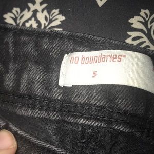 Black jean shorts, lace detail on the sides—size 5